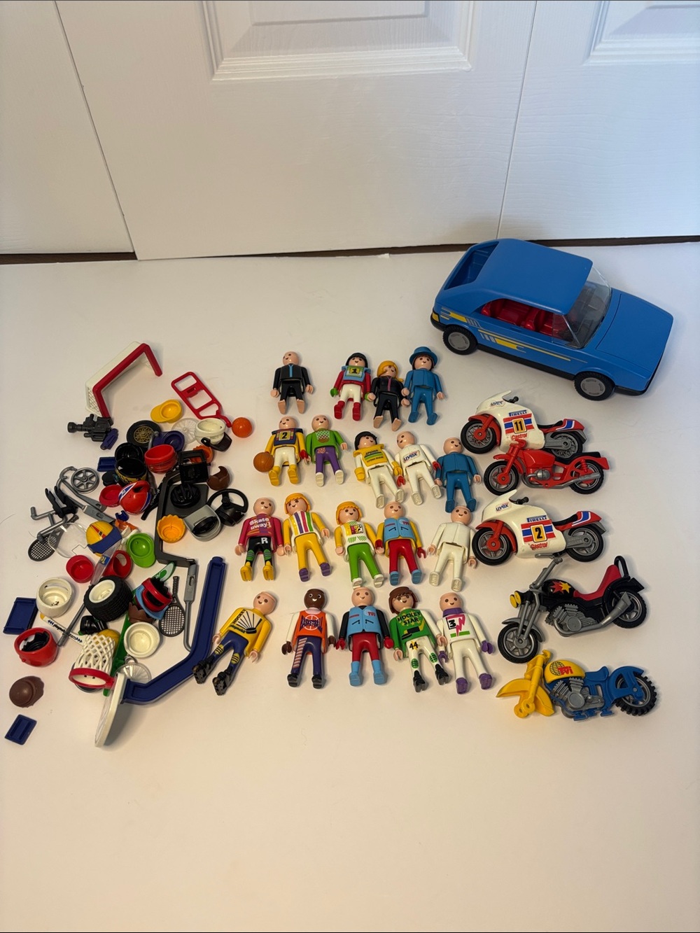 Vintage Playmobil mixed lot featuring vehicles, figures, and accessories.